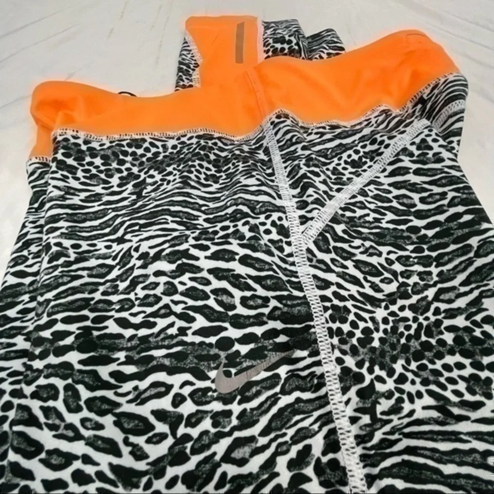 Nike Dri-Fit Women Cropped Leggings Medium | Black White Orange